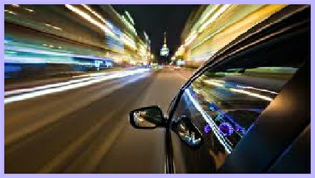 snapshot of speeding car from back window with blurry lights