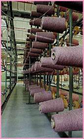 banks of cotton thread on rolls.  thread mill servers