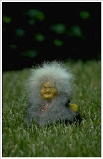 figurine of a troll in the grass