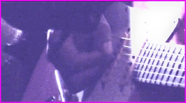 Close up view of an electric guitar being played