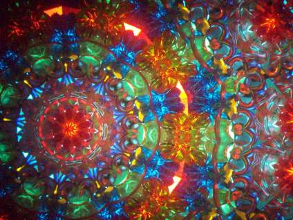 kaleidoscopic pattern with reds, greens, and blues