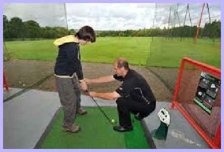Picture of youth taking golf insruction with the golf club