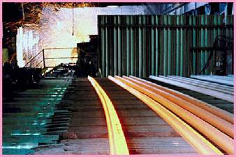 glowing hot metal rails, manufacturing process